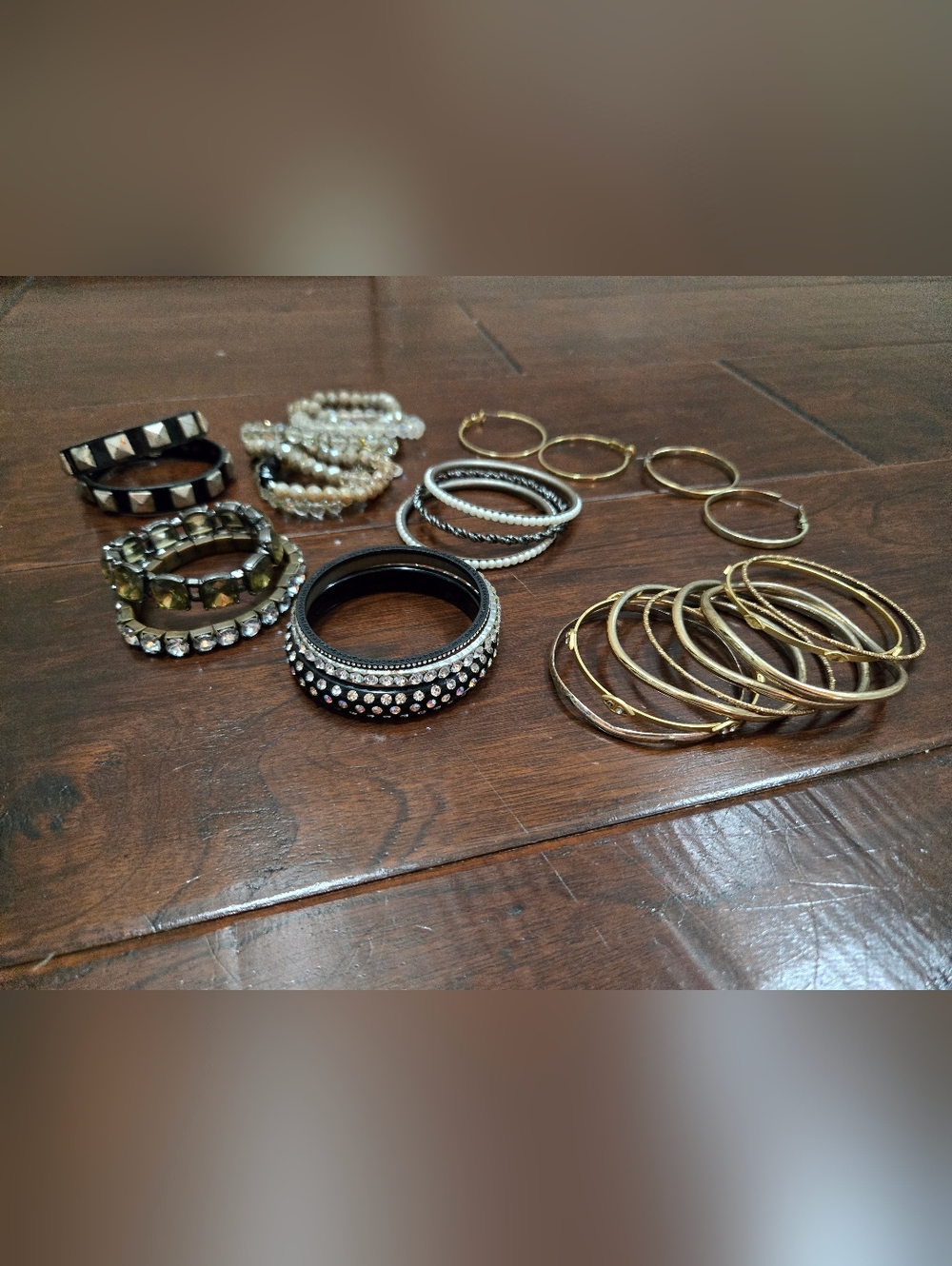 Gold and Black Crystal-Accent Bangle Bracelet And 2 Sets Gold Earrings.
